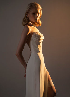 White chiffon dress with a split.