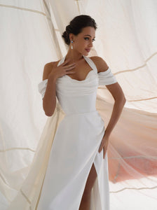 off - shoulder wedding dress. satin dress with a slit