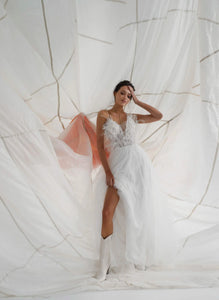 A-line wedding dress with feathers. Glamorous weddin dress online.