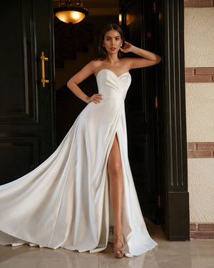 Budget wedding dress online. Simple white bridal gown. Simple white dress for civil wedding. Affordable wedding dresses online. Wedding dress with a slit.