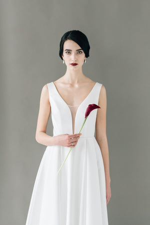 A-line wedding dress online. V-neck wedding dress. Minimal white dress for brides.
