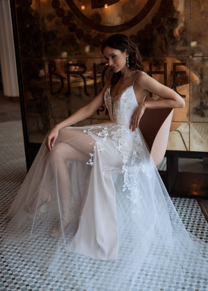 Sparkling tulle wedding dress with star applications.
